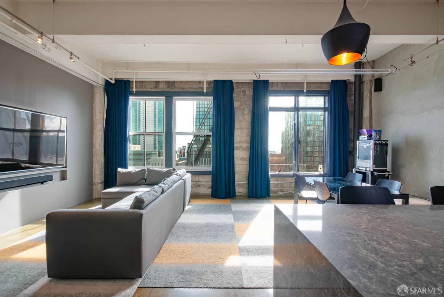 2 Mint Plaza, Unit 905 San Francisco, CA 94103 - Photo 2 of 21 a living room with furniture and a large window