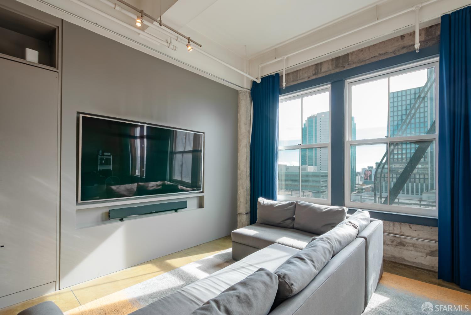 2 Mint Plaza, Unit 905 San Francisco, CA 94103 - Photo 3 of 21 a bedroom with furniture and large windows