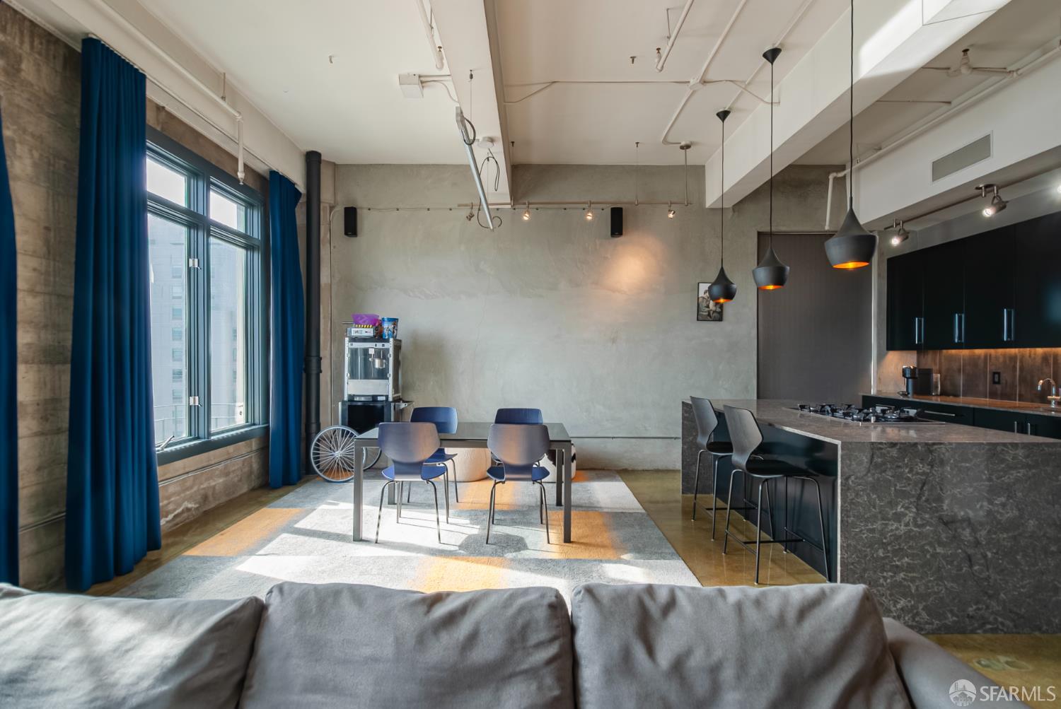 2 Mint Plaza, Unit 905 San Francisco, CA 94103 - Photo 5 of 21 a living room with furniture and a flat screen tv