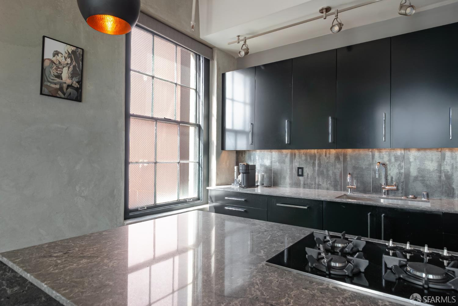 2 Mint Plaza, Unit 905 San Francisco, CA 94103 - Photo 7 of 21 a kitchen with a sink and a stove top oven