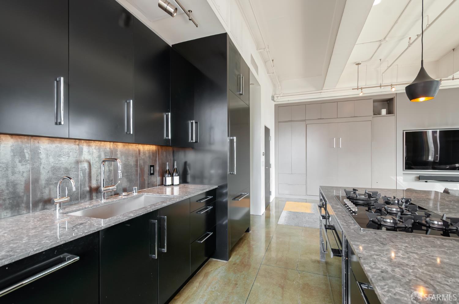 2 Mint Plaza, Unit 905 San Francisco, CA 94103 - Photo 8 of 21 a kitchen with a sink and cabinets