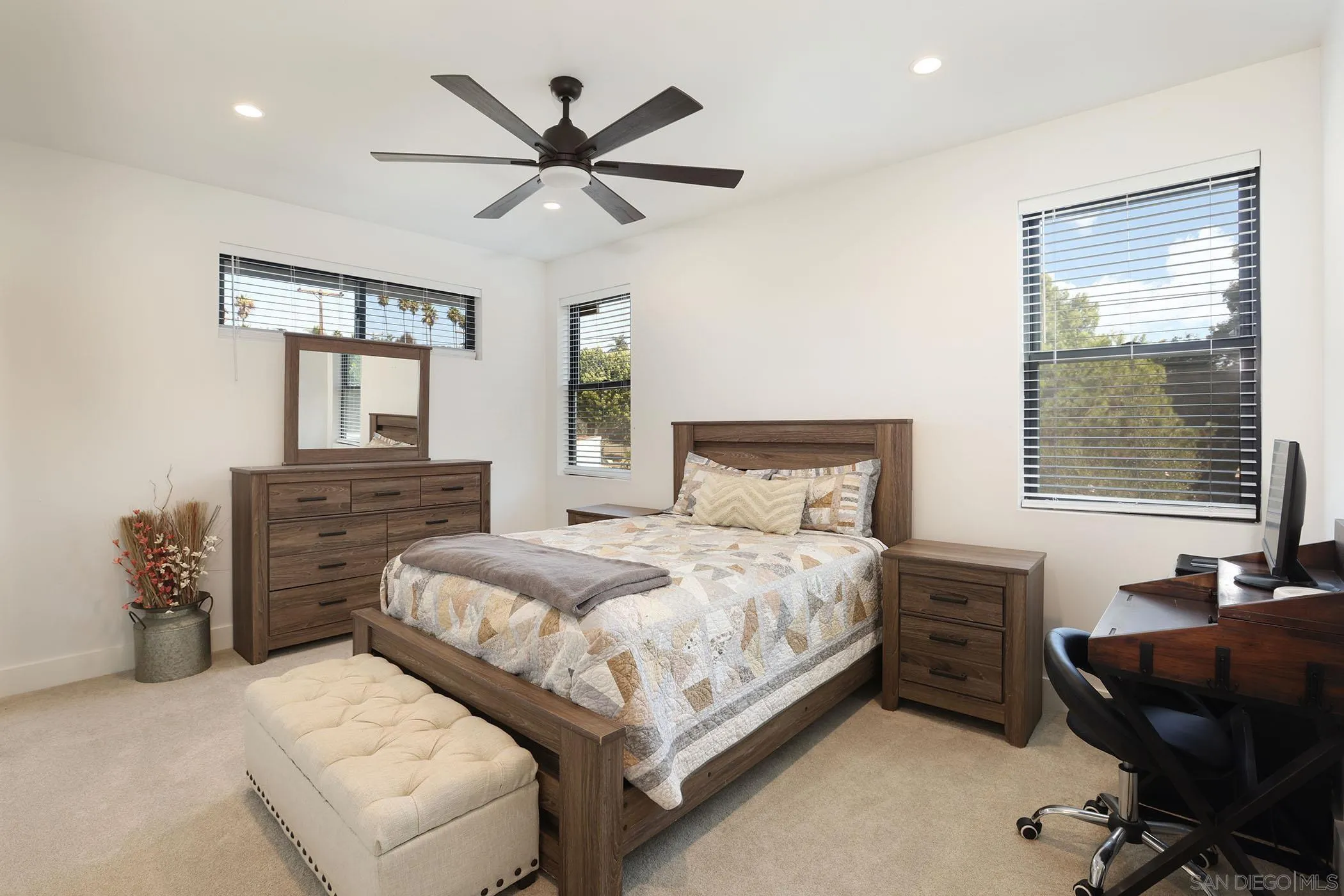 1686-88 Gecko Road Vista, CA 92083 - Photo 11 of 30 a bedroom with a bed and wooden floor