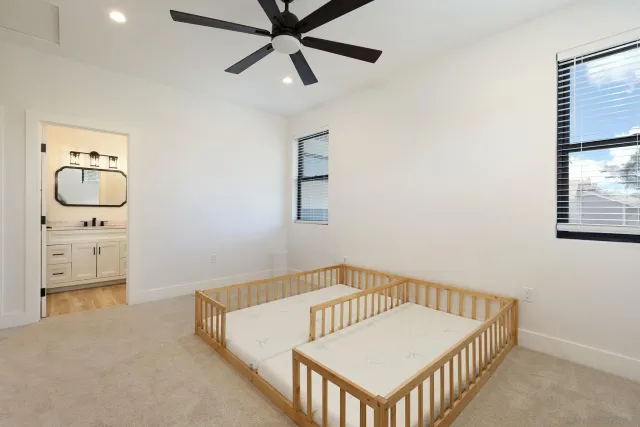 a bedroom with furniture and a window