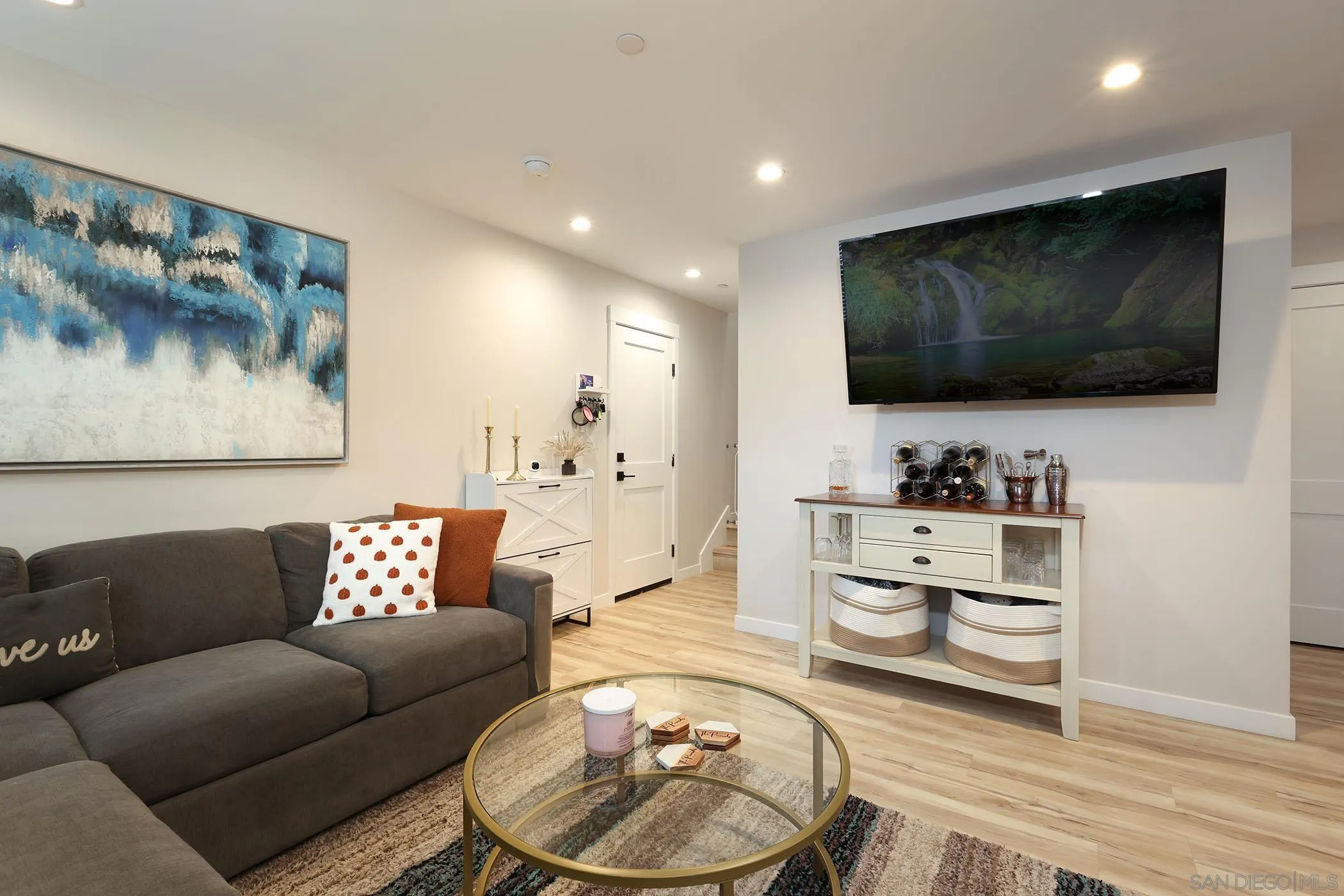 1686-88 Gecko Road Vista, CA 92083 - Photo 23 of 30 a living room with furniture and a flat screen tv