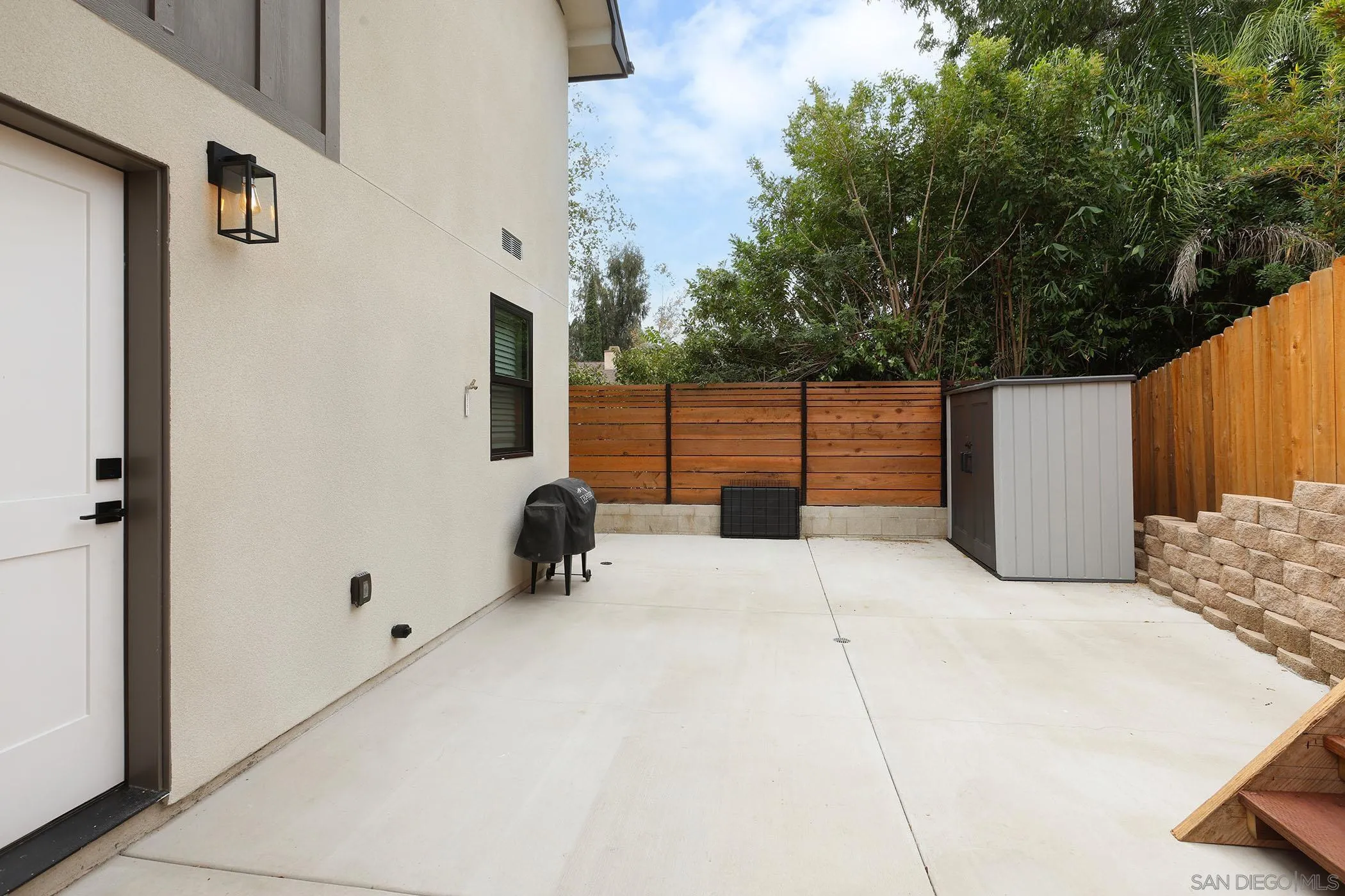 1686-88 Gecko Road Vista, CA 92083 - Photo 25 of 30 a view of backyard with a large tree