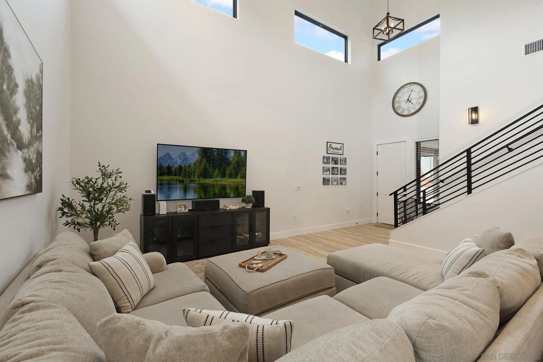 1686-88 Gecko Road Vista, CA 92083 - Photo 3 of 30 a living room with furniture and a flat screen tv