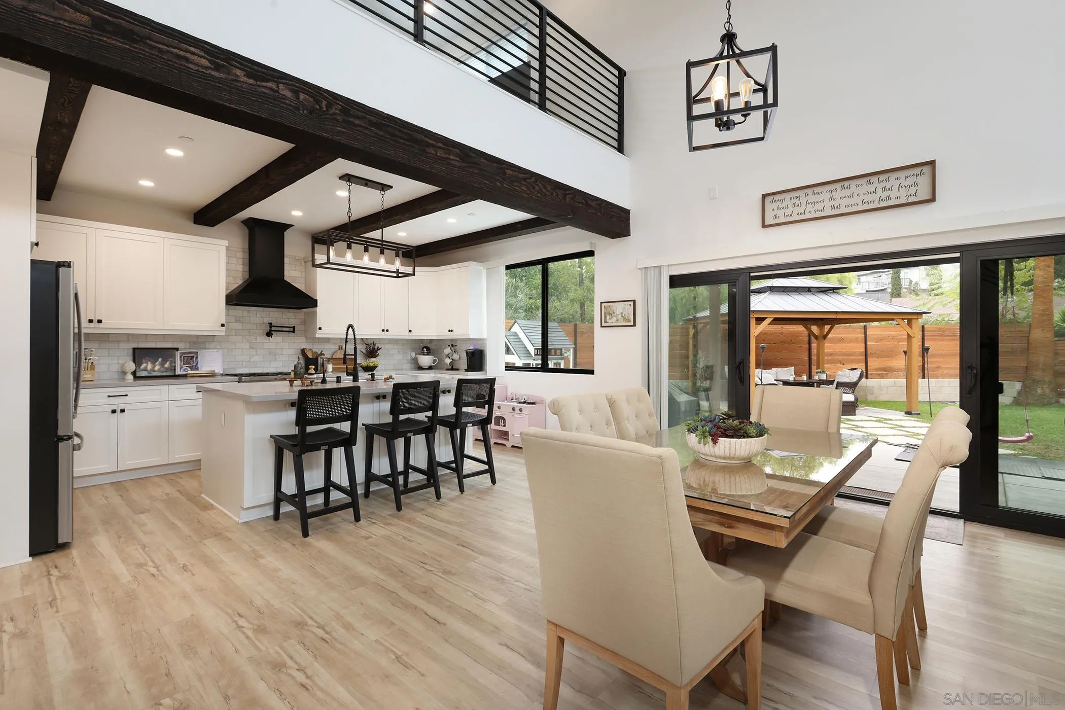 1686-88 Gecko Road Vista, CA 92083 - Photo 4 of 30 a view of a dining room with furniture window and wooden floor