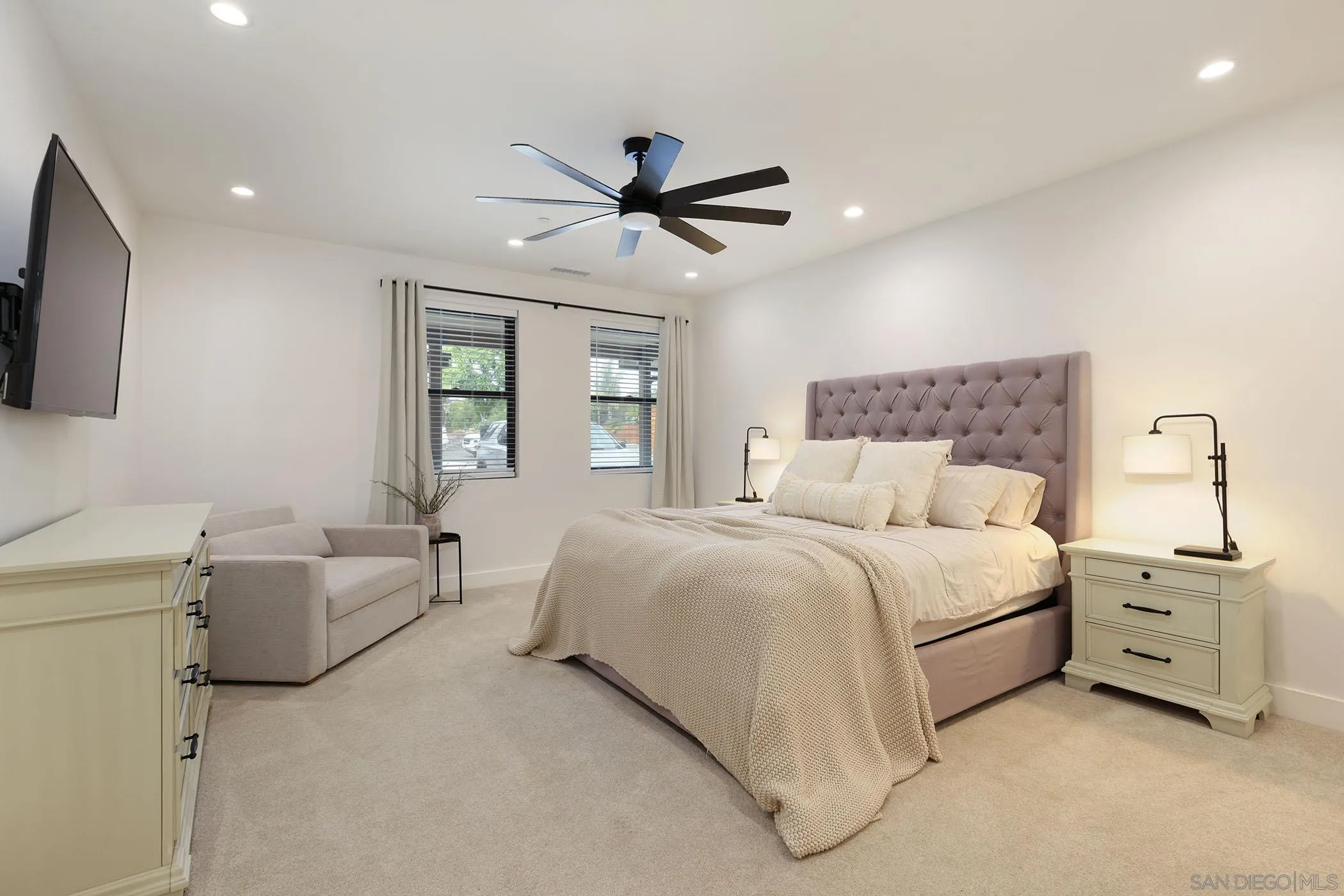 1686-88 Gecko Road Vista, CA 92083 - Photo 6 of 30 a bedroom with a bed and a flat screen tv