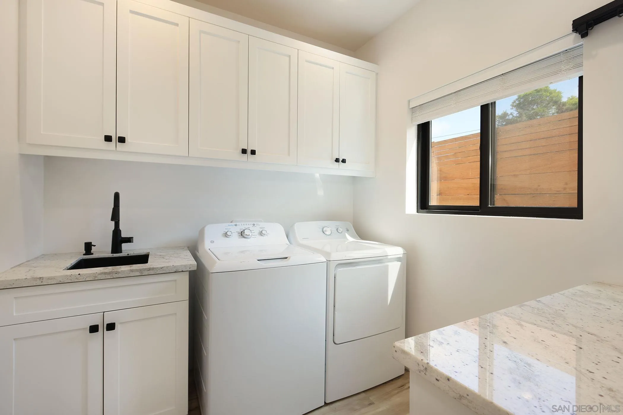 1686-88 Gecko Road Vista, CA 92083 - Photo 8 of 30 a utility room with dryer and washer