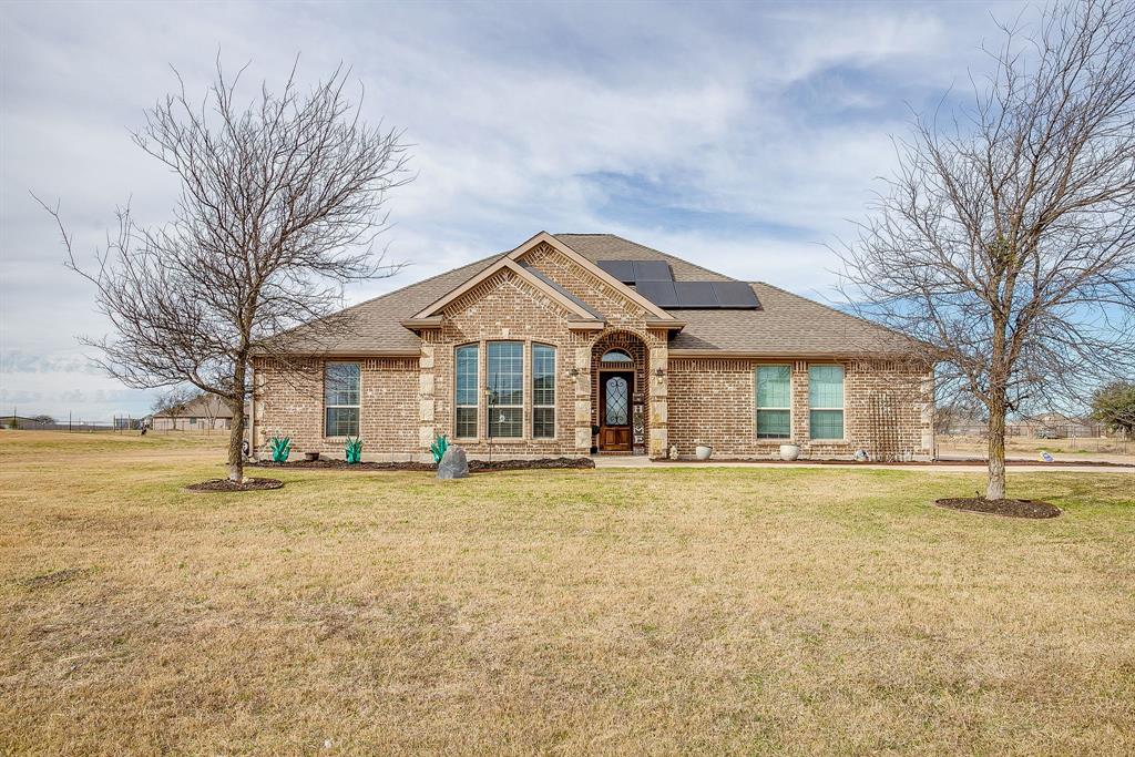 8005 Canyon Ridge Drive Godley, TX 76044 - Photo 1 of 40 a front view of a house with a yard