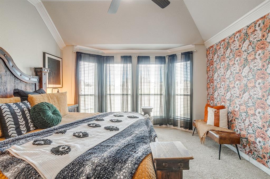 8005 Canyon Ridge Drive Godley, TX 76044 - Photo 22 of 40 a bedroom with a bed and a table