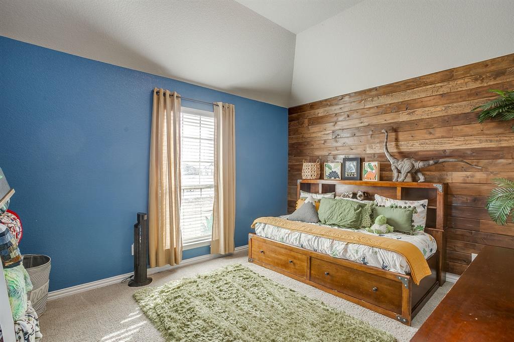 8005 Canyon Ridge Drive Godley, TX 76044 - Photo 32 of 40 a bedroom with a bed and a window