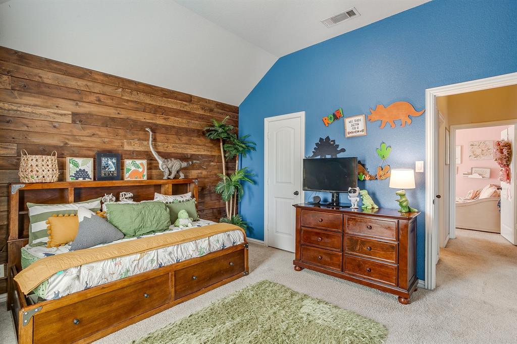 8005 Canyon Ridge Drive Godley, TX 76044 - Photo 33 of 40 a bed room with a bed and a television