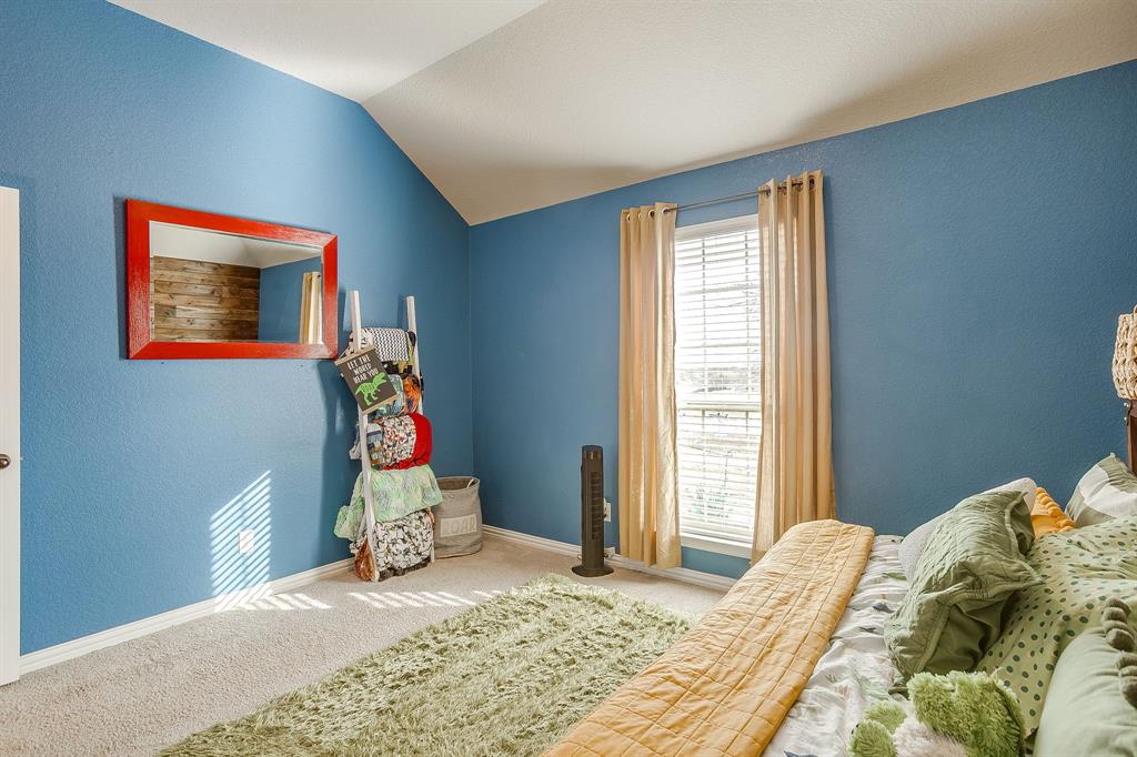 8005 Canyon Ridge Drive Godley, TX 76044 - Photo 34 of 40 a bedroom with a bed and window