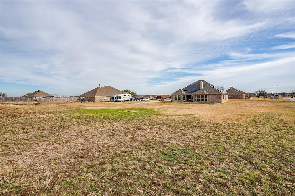 8005 Canyon Ridge Drive Godley, TX 76044 - Photo 35 of 40 a view of an ocean and beach