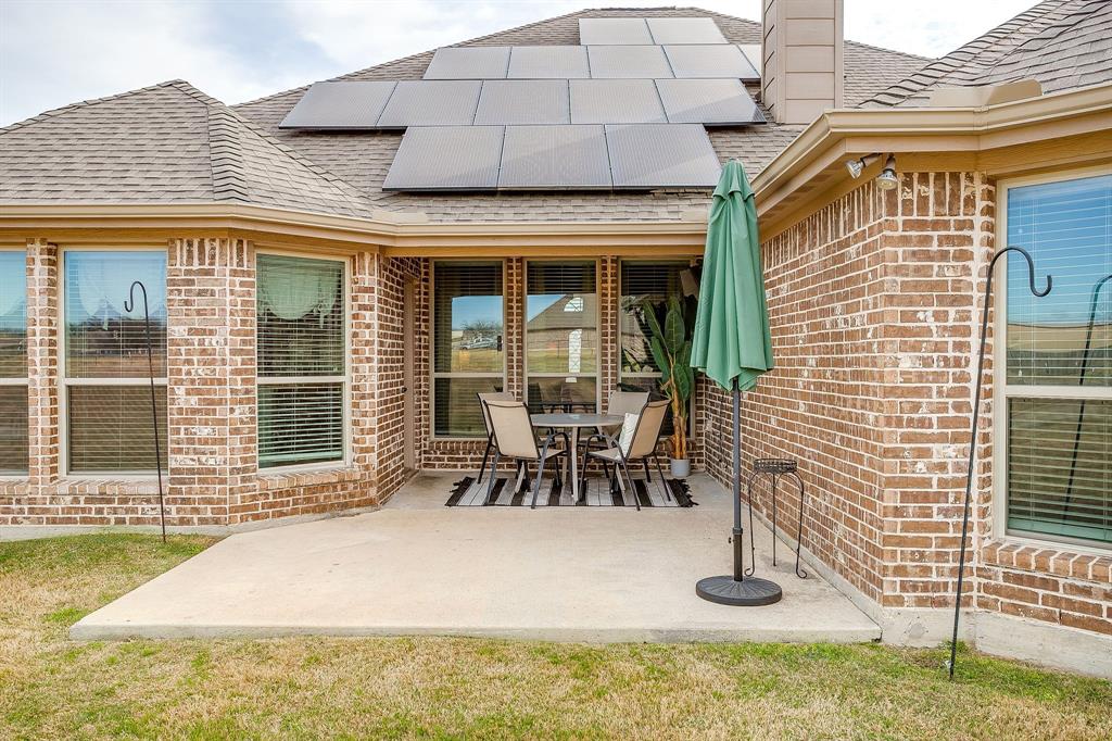 8005 Canyon Ridge Drive Godley, TX 76044 - Photo 38 of 40 a view of a house with dining area and wooden fence