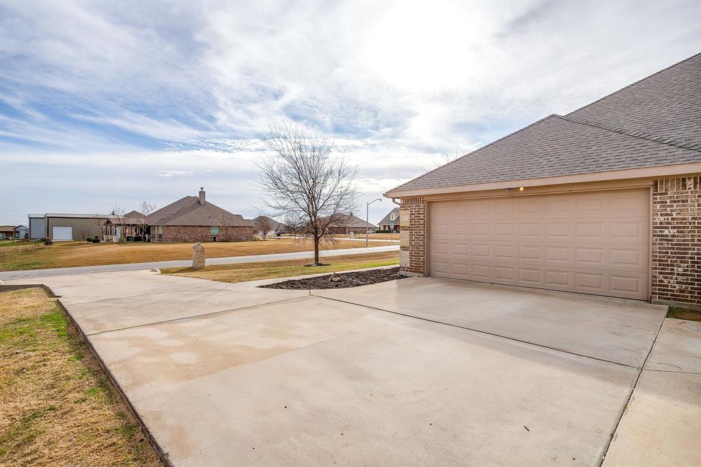 8005 Canyon Ridge Drive Godley, TX 76044 - Photo 40 of 40 a view of swimming pool with an outdoor seating