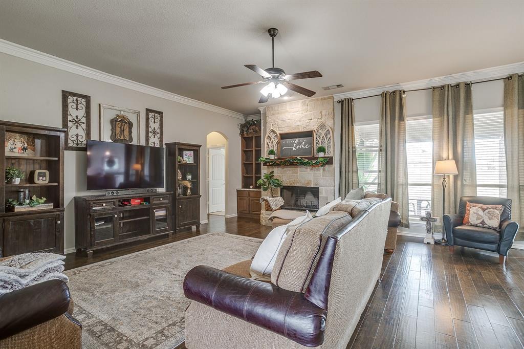 8005 Canyon Ridge Drive Godley, TX 76044 - Photo 9 of 40 a living room with furniture and a flat screen tv