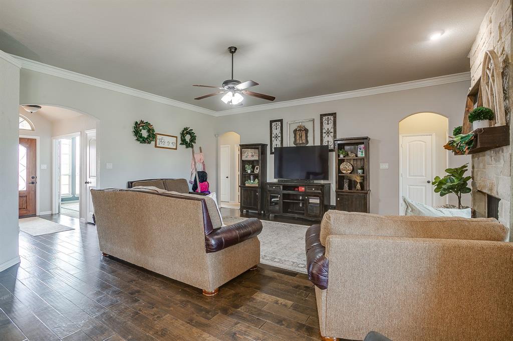 8005 Canyon Ridge Drive Godley, TX 76044 - Photo 10 of 40 a living room with furniture and a flat screen tv