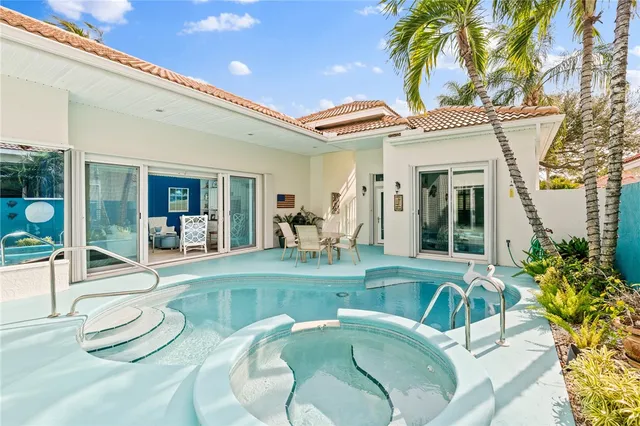 a view of a livingroom with furniture and a floor to ceiling window