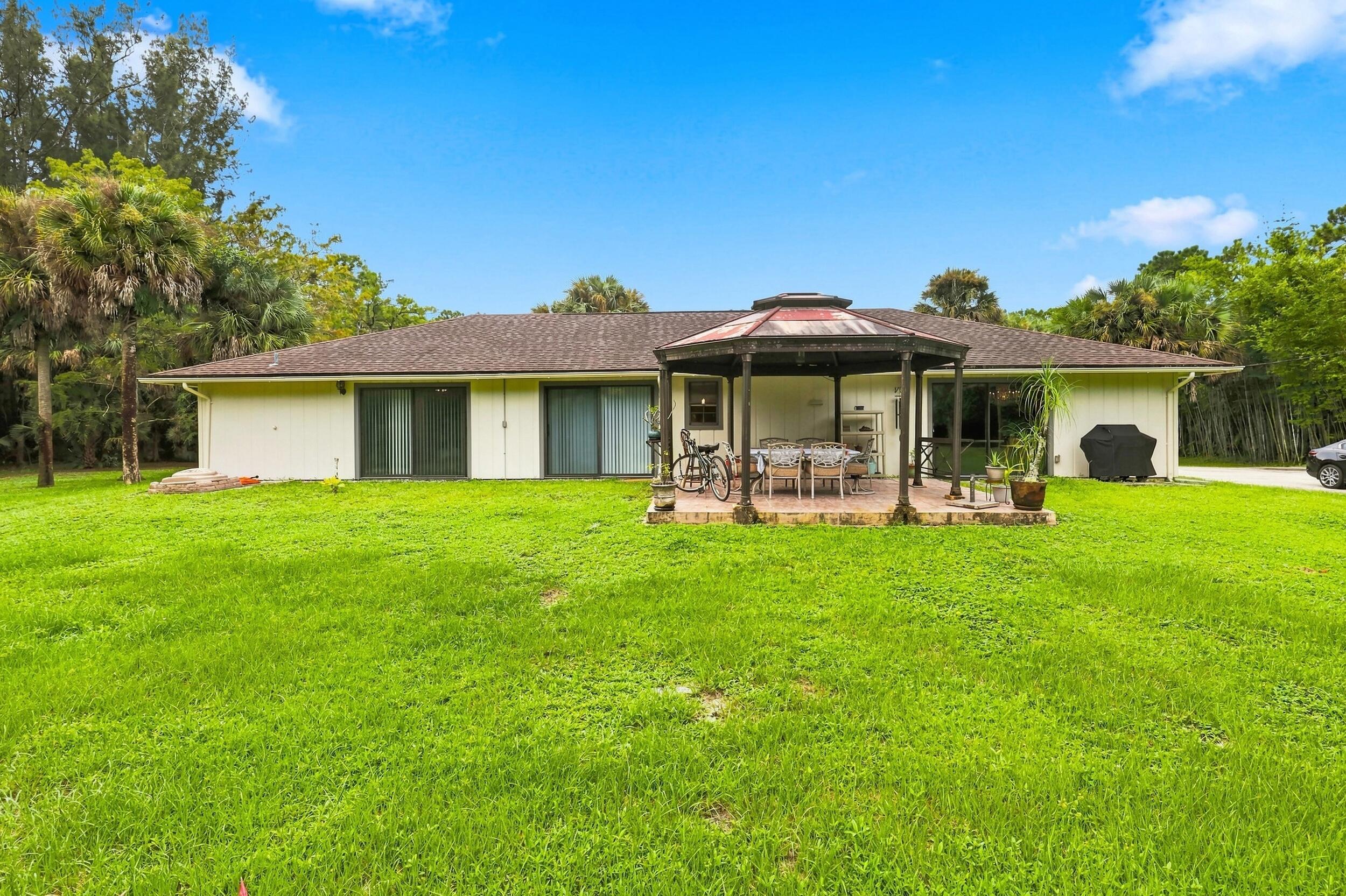 12871 Compton Road Loxahatchee Groves, FL 33470 - Photo 40 of 51 Rear Exterior & Backyard