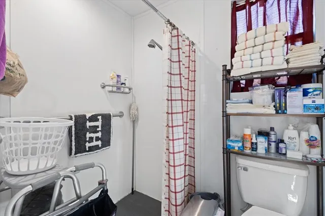 an aerial view of residential house with outdoor space and trees all around