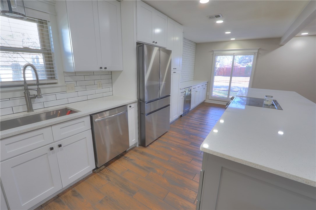 5209 Bromley Drive Corpus Christi, TX 78413 - Photo 13 of 31 a kitchen with stainless steel appliances a refrigerator and a sink