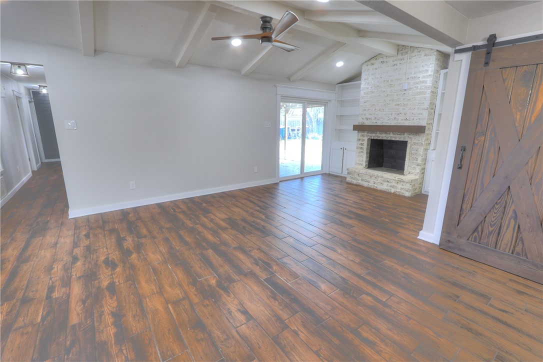 5209 Bromley Drive Corpus Christi, TX 78413 - Photo 16 of 31 an empty room with wooden floor and windows