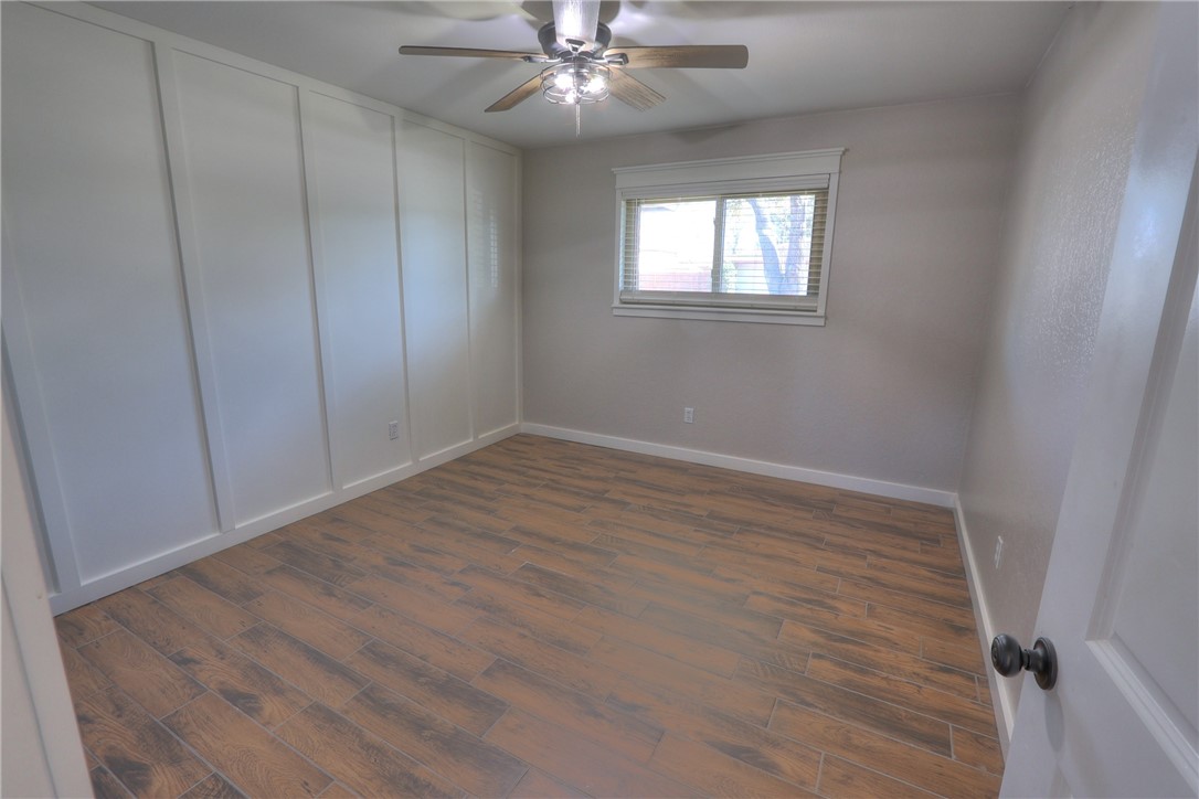 5209 Bromley Drive Corpus Christi, TX 78413 - Photo 23 of 31 wooden floor in an empty room with a window