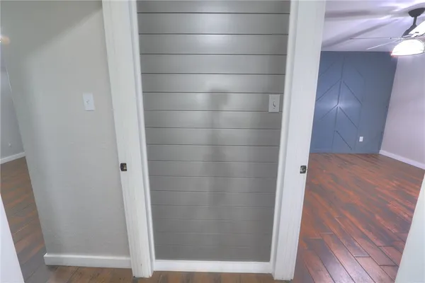 a bathroom with a glass door shower