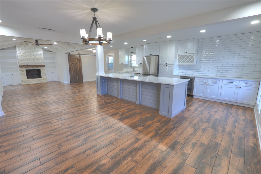 5209 Bromley Drive Corpus Christi, TX 78413 - Photo 8 of 31 a large kitchen with granite countertop a large counter top space and stainless steel appliances