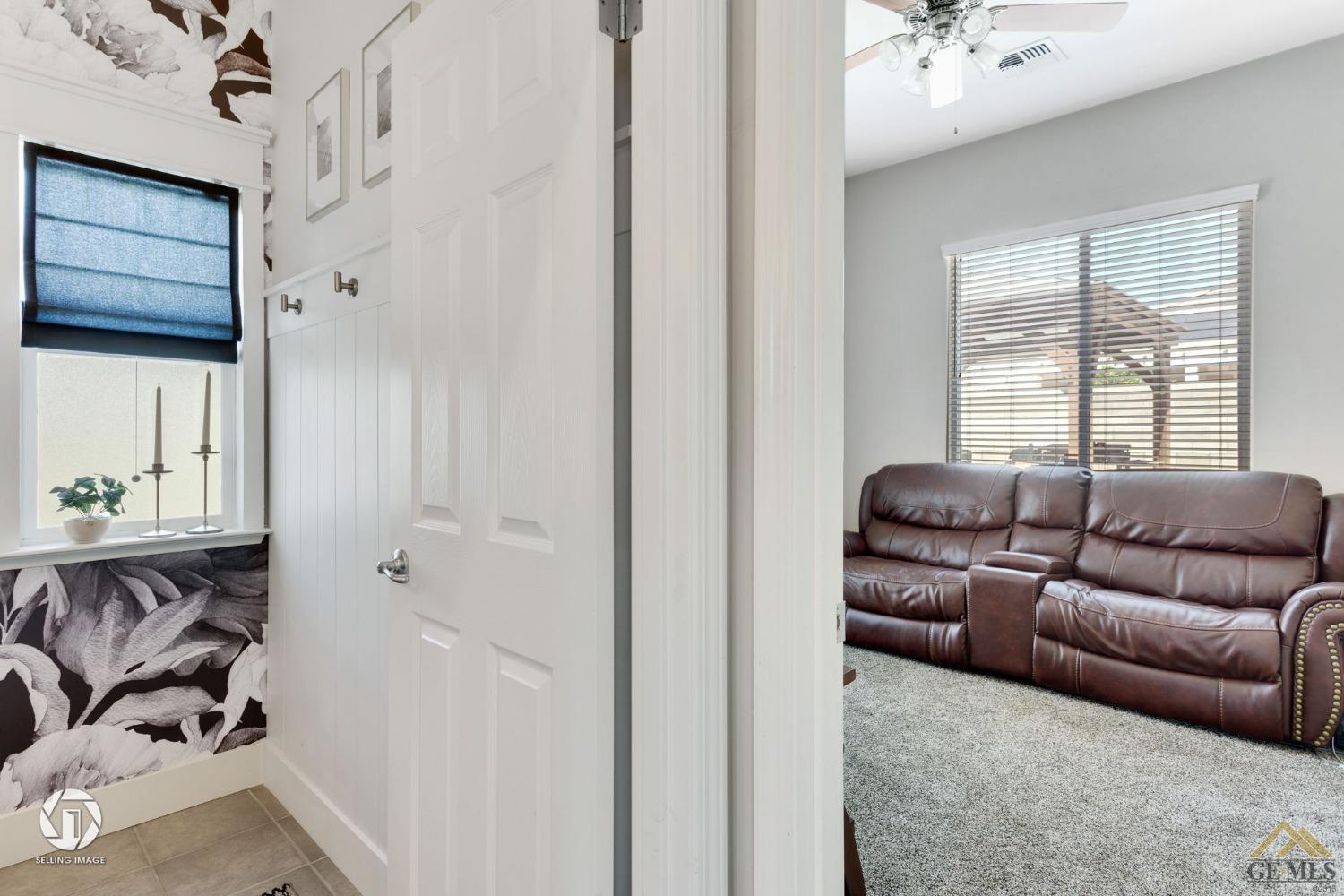 Undisclosed Address Bakersfield, CA 93313 - Photo 12 of 50 a living room with furniture and a window