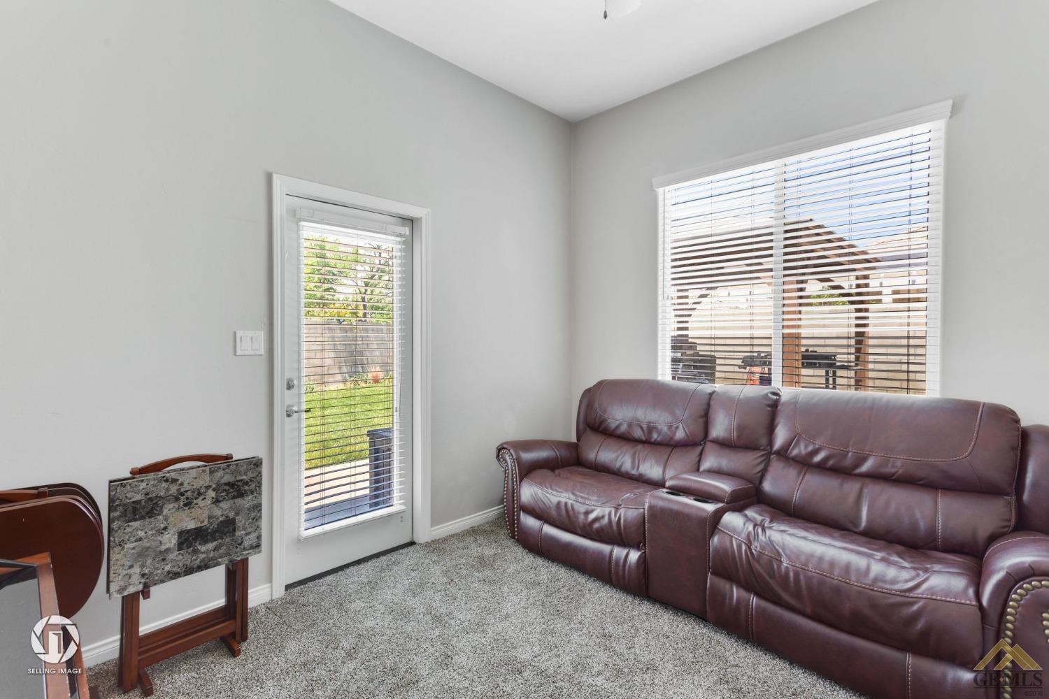 Undisclosed Address Bakersfield, CA 93313 - Photo 13 of 50 a living room with furniture and a window