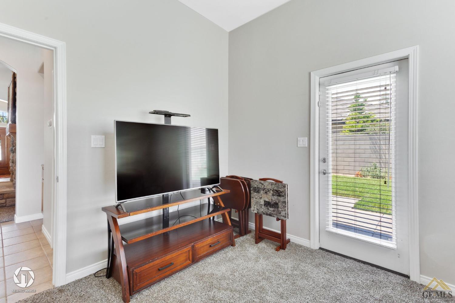 Undisclosed Address Bakersfield, CA 93313 - Photo 14 of 50 a living room with furniture and a window