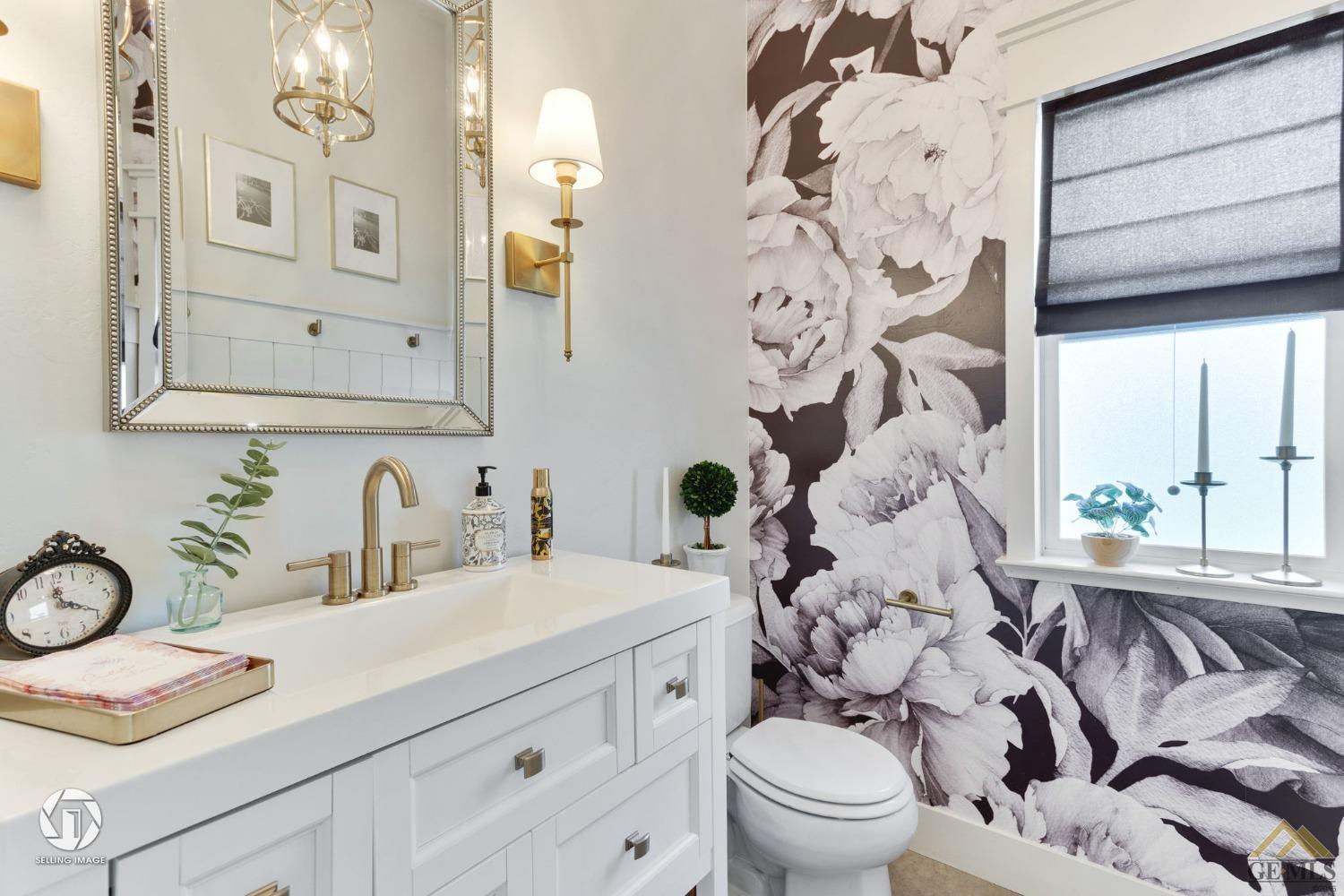 Undisclosed Address Bakersfield, CA 93313 - Photo 15 of 50 a bathroom with a sink a toilet and a window