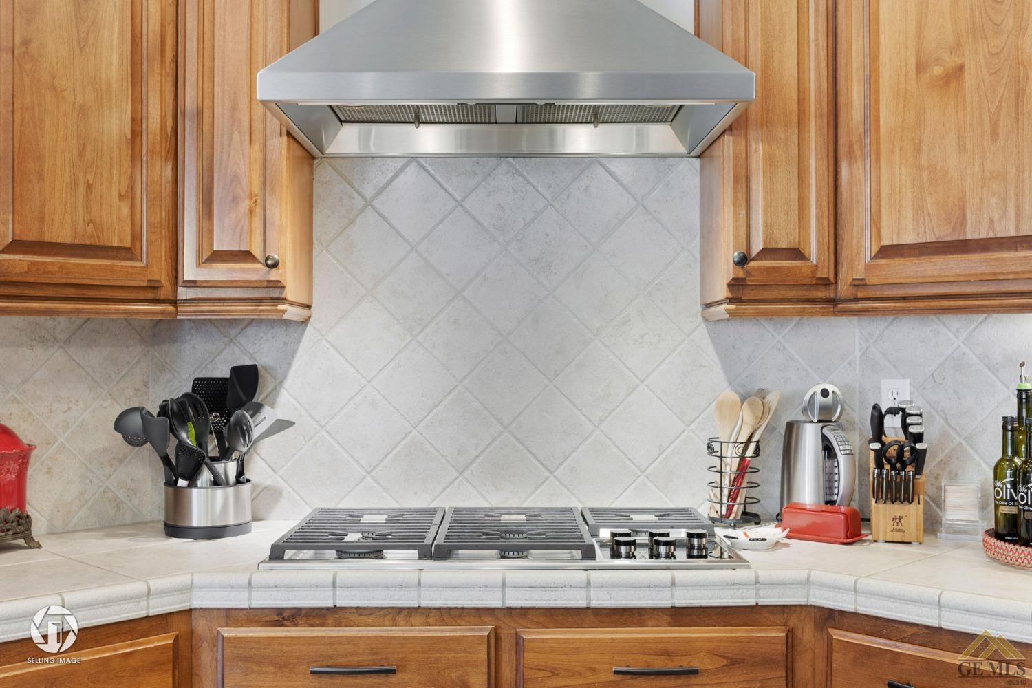 Undisclosed Address Bakersfield, CA 93313 - Photo 26 of 50 a kitchen with a sink and cabinets