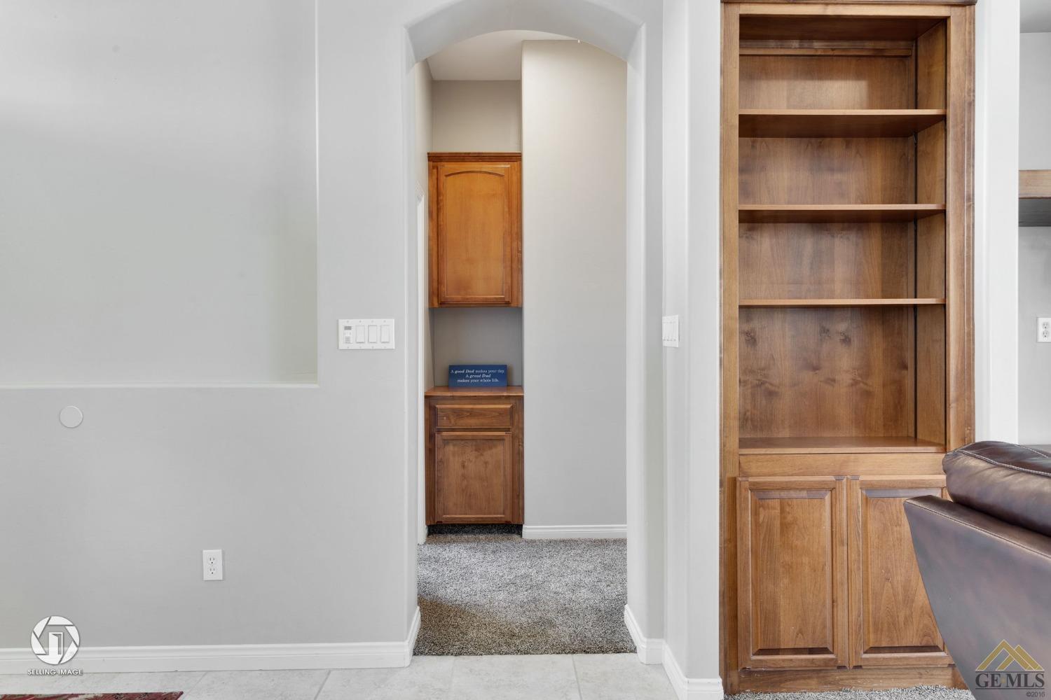 Undisclosed Address Bakersfield, CA 93313 - Photo 29 of 50 a view of walk in closet with empty racks