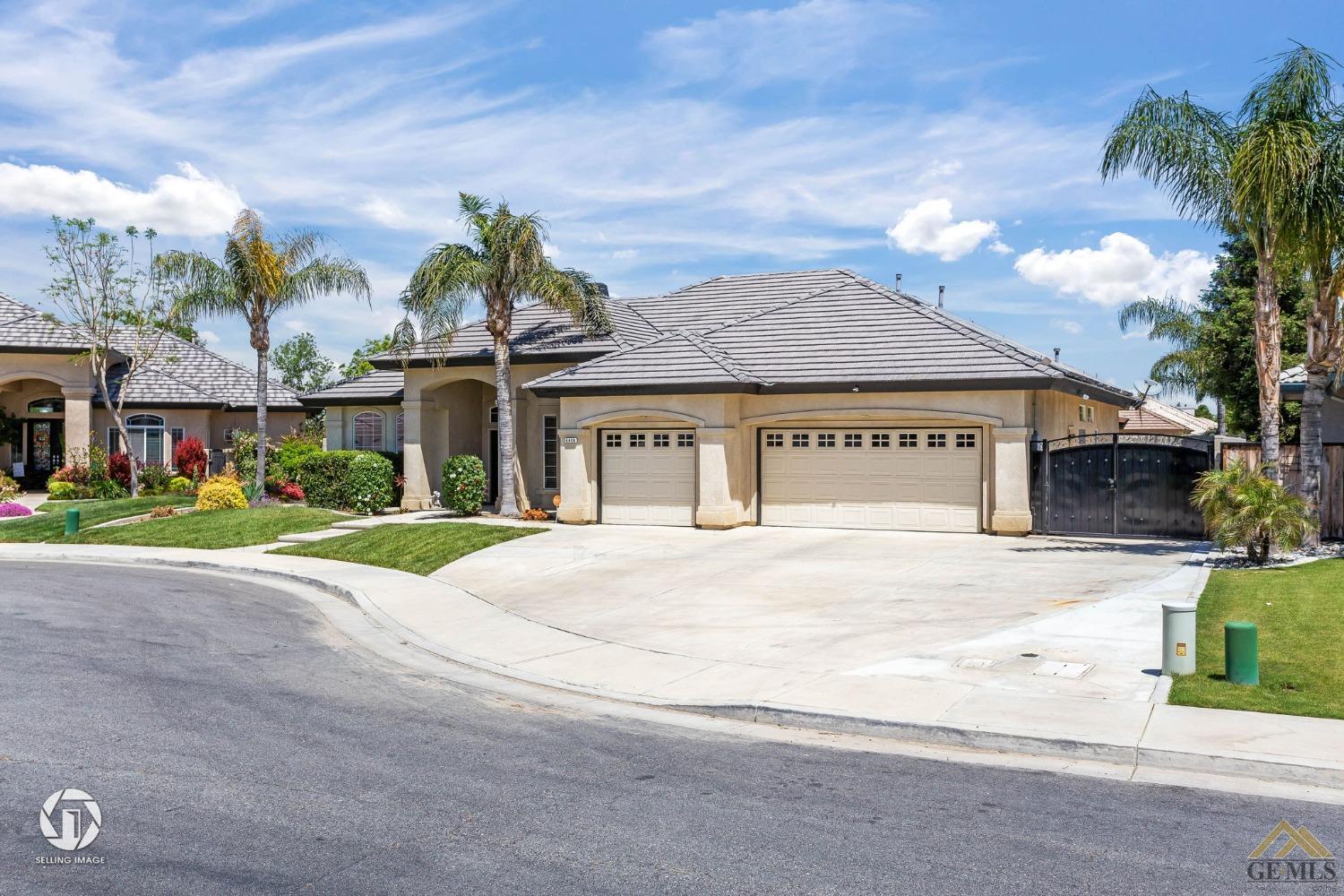 Undisclosed Address Bakersfield, CA 93313 - Photo 3 of 50 a view of a house with a yard and a garden