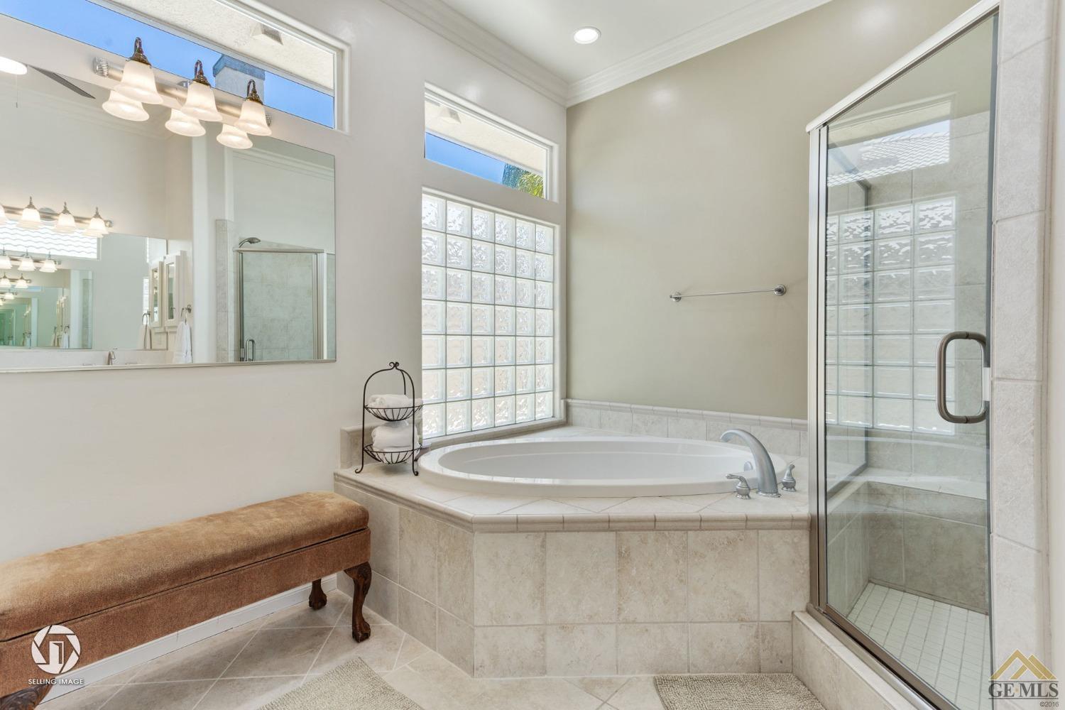 Undisclosed Address Bakersfield, CA 93313 - Photo 34 of 50 a bathroom with a sink a toilet and shower