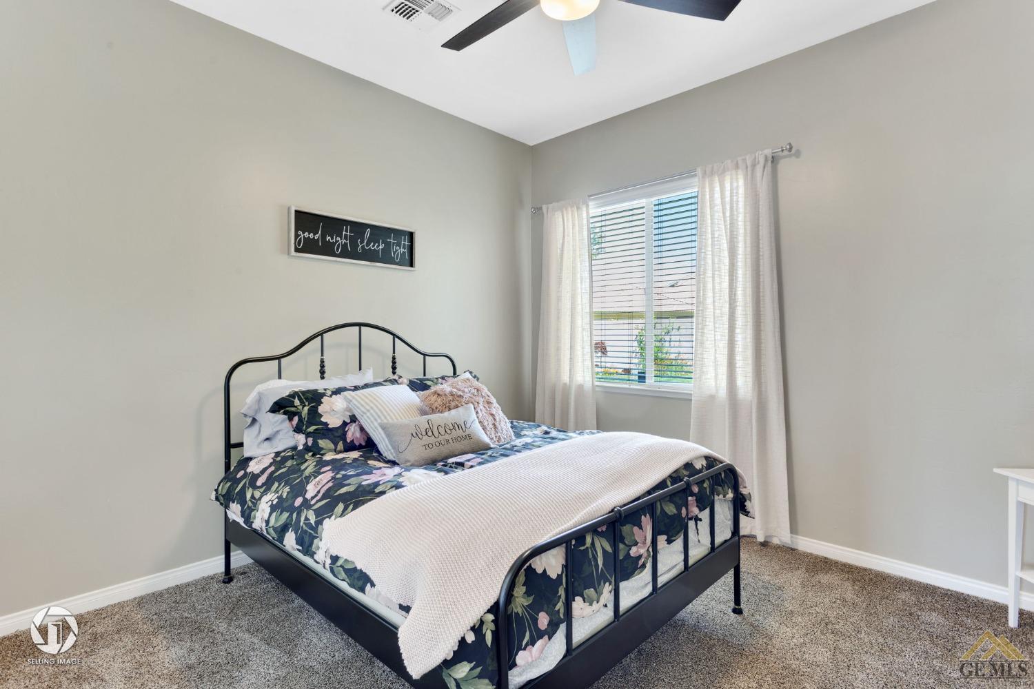 Undisclosed Address Bakersfield, CA 93313 - Photo 37 of 50 a bedroom with a bed and a window