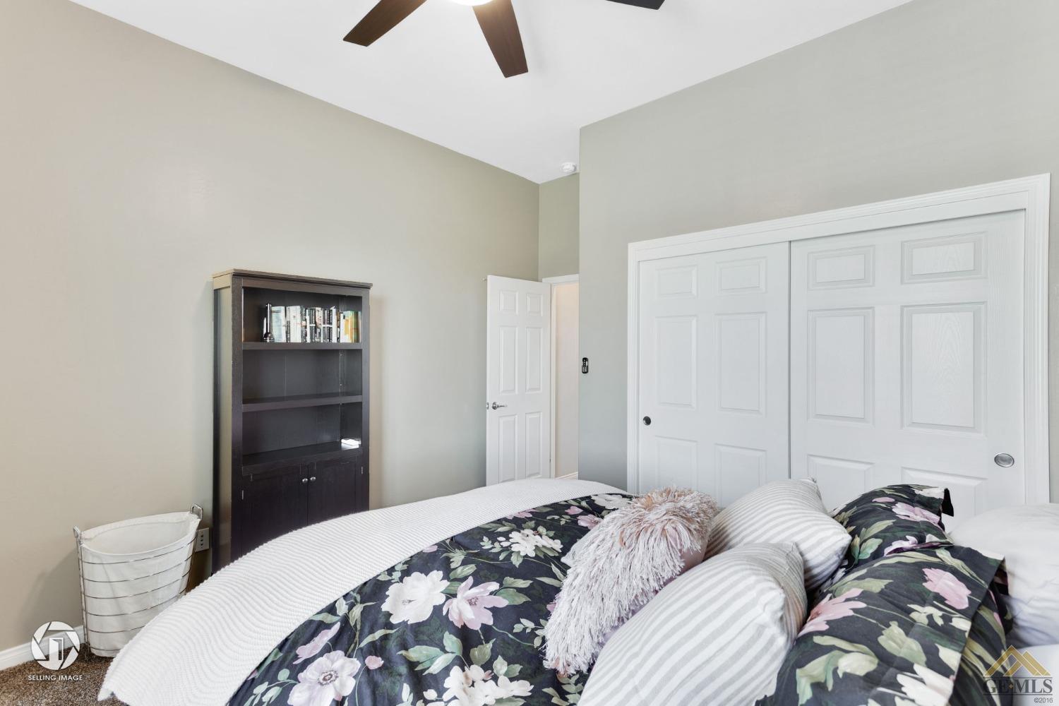 Undisclosed Address Bakersfield, CA 93313 - Photo 39 of 50 a bedroom with a bed and a chandelier