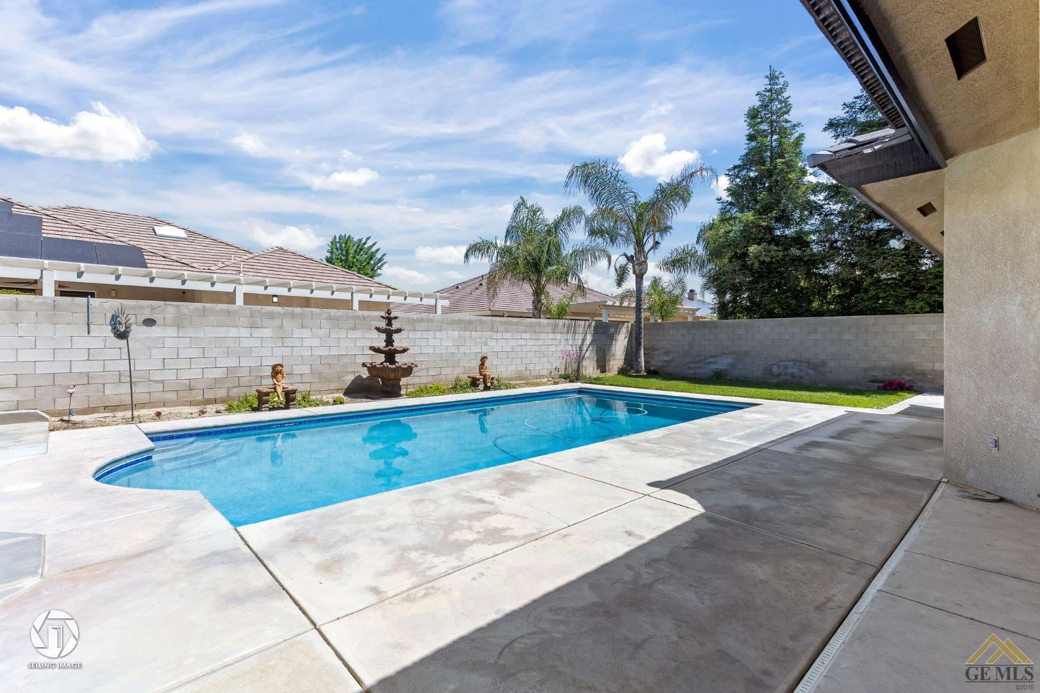 Undisclosed Address Bakersfield, CA 93313 - Photo 44 of 50 a view of a swimming pool with a lounge chair
