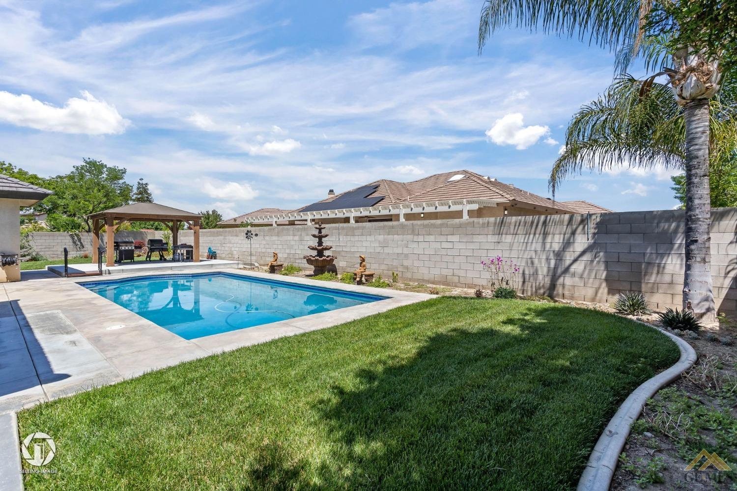 Undisclosed Address Bakersfield, CA 93313 - Photo 45 of 50 a view of a house with a swimming pool