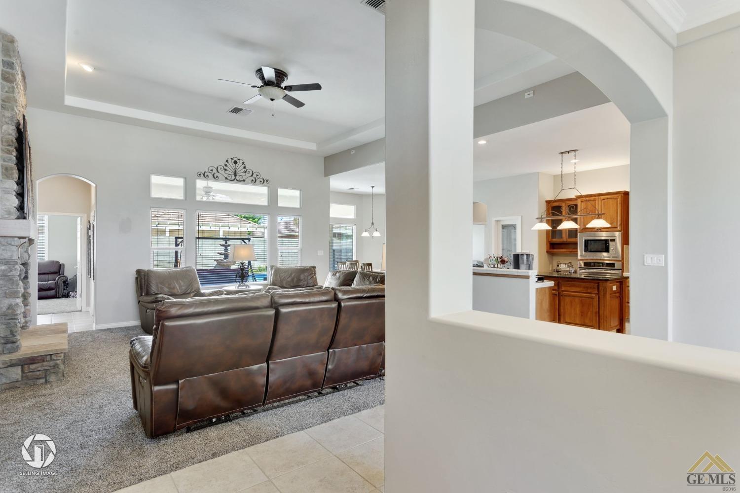Undisclosed Address Bakersfield, CA 93313 - Photo 7 of 50 a living room with furniture and kitchen view