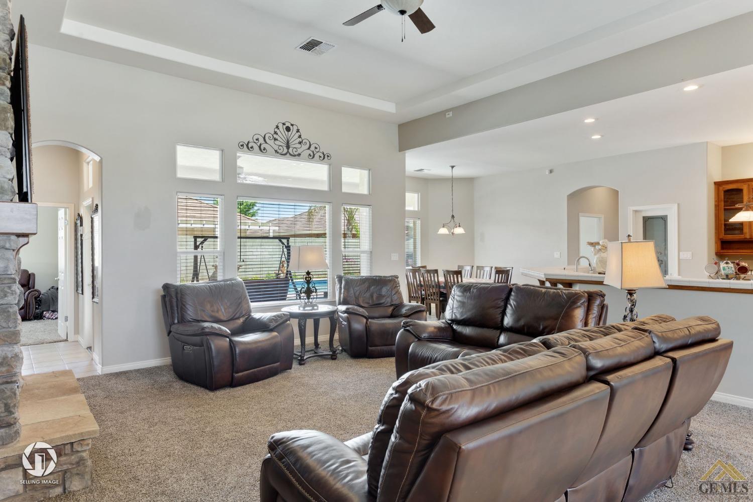 Undisclosed Address Bakersfield, CA 93313 - Photo 8 of 50 a living room with furniture and a large window