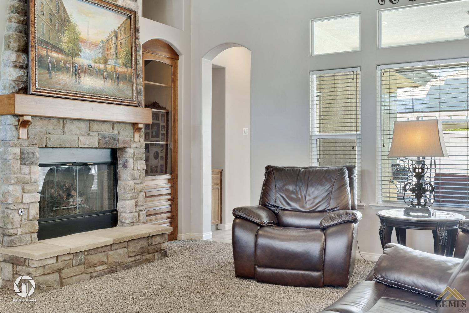 Undisclosed Address Bakersfield, CA 93313 - Photo 10 of 50 a living room with furniture and a fireplace