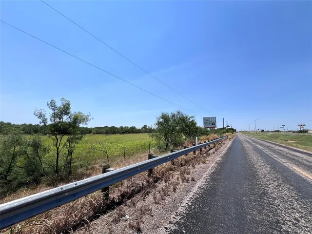 a view of a road with an ocean view