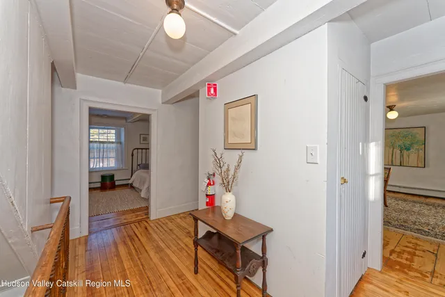 a view of an empty room and a window