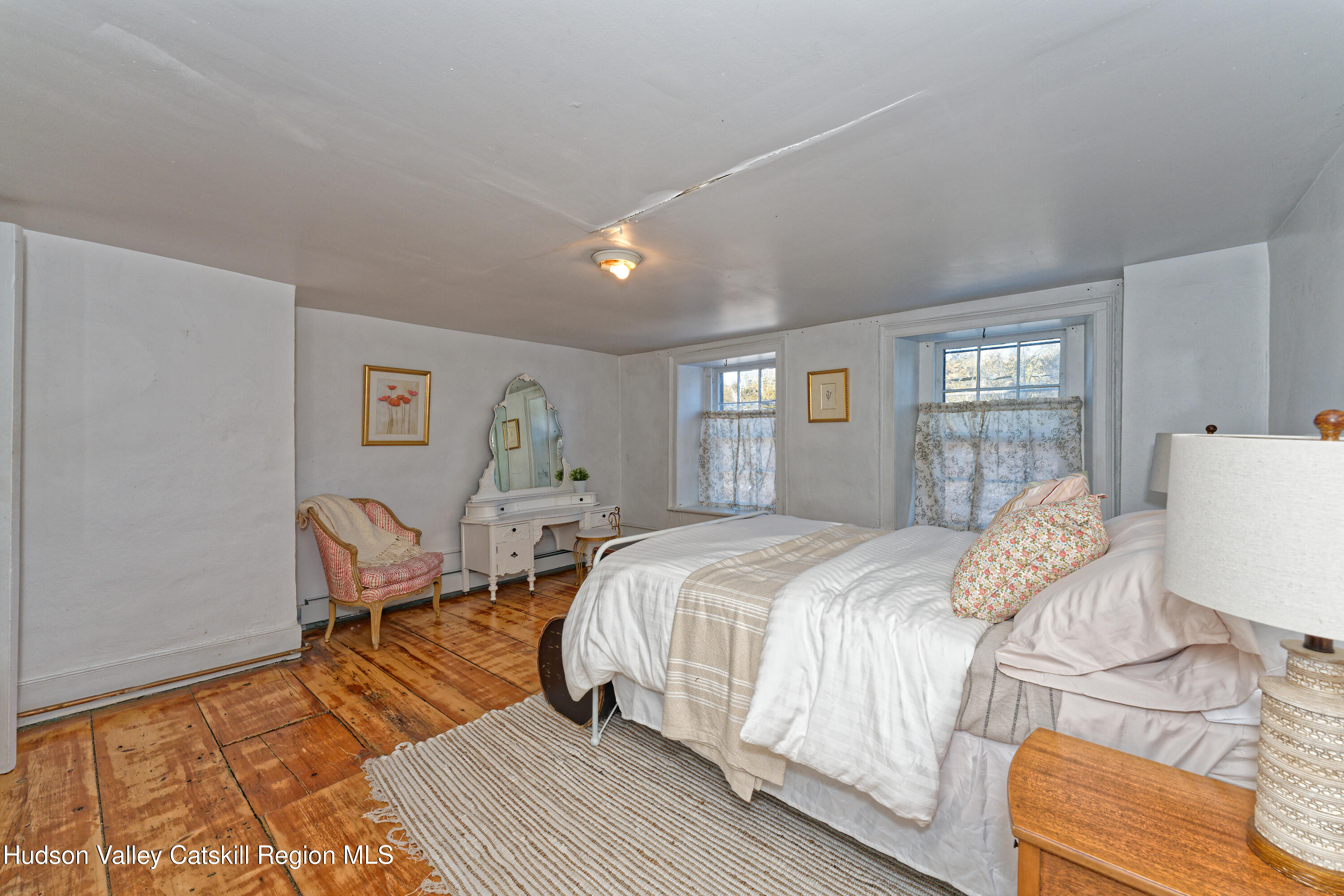 3953-3955 Highway 209 Stone Ridge, NY 12484 - Photo 21 of 69 a bedroom with a bed and a chair