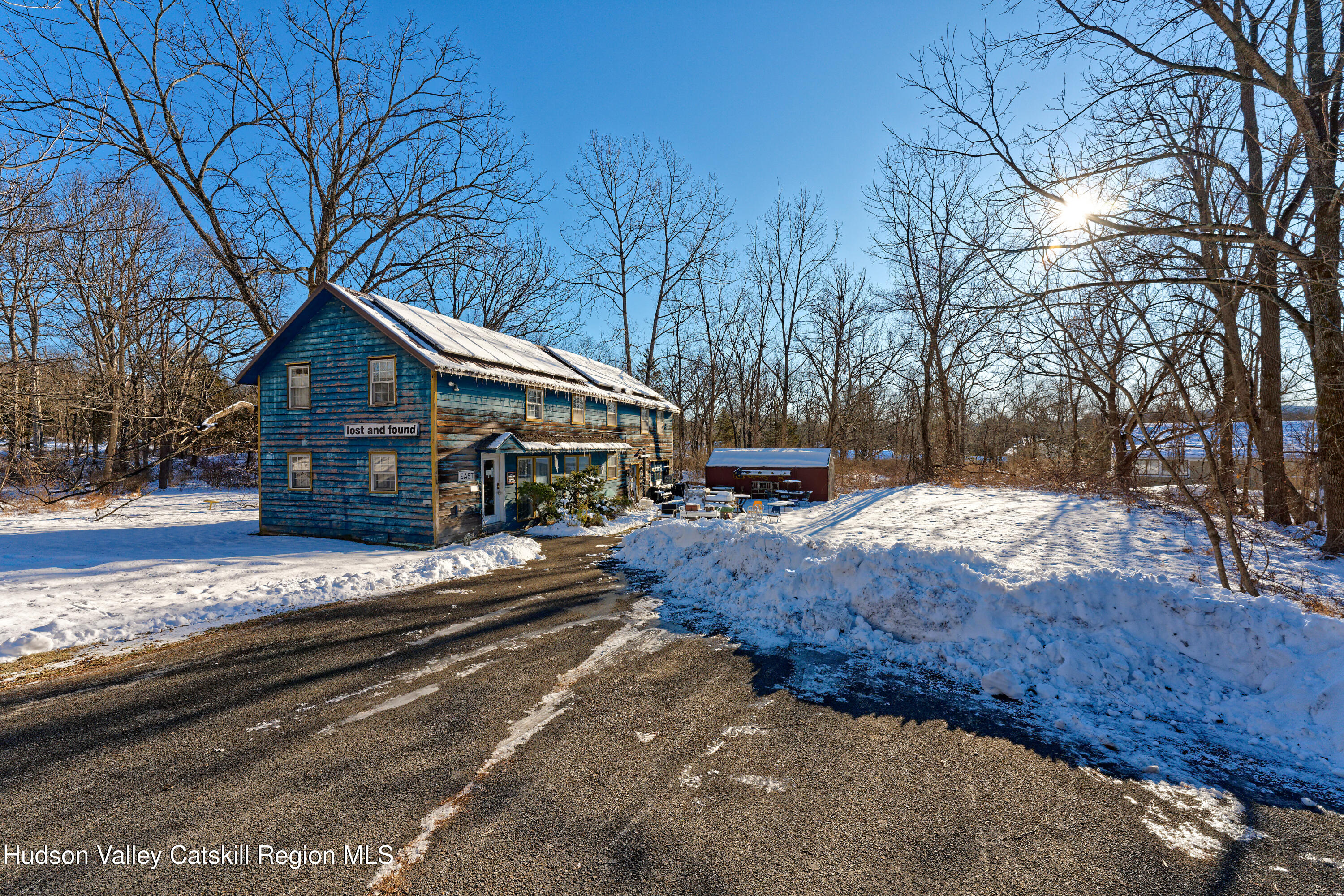 3953-3955 Highway 209 Stone Ridge, NY 12484 - Photo 32 of 69 a front view of a house with a yard covered with snow in front of house